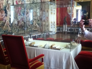 Dining table, with stools for courtiers in the background.